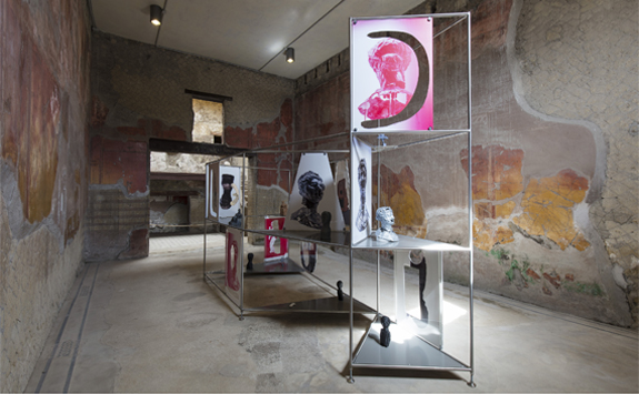 Large room in ancient building with sculpture made from metal and glass 